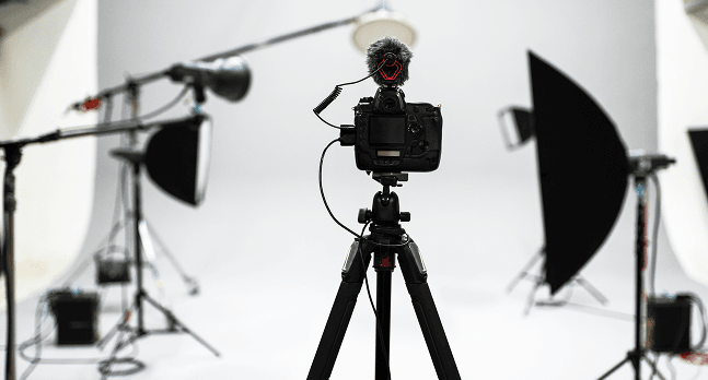 Professional studio space with camera and lighting equipment